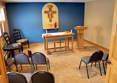 small Catholic chapel room with chairs