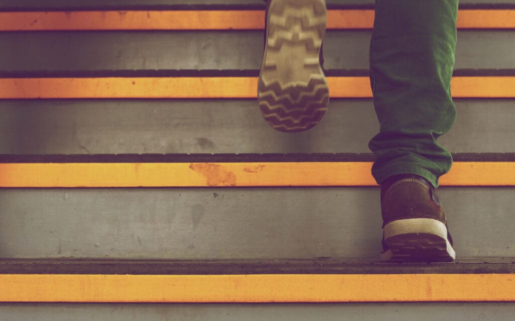 Problems With 12 Step Programs - Why 12 Step Programs Aren't the Best Choice, closeup of feet going up stairs - problems with 12-step programs