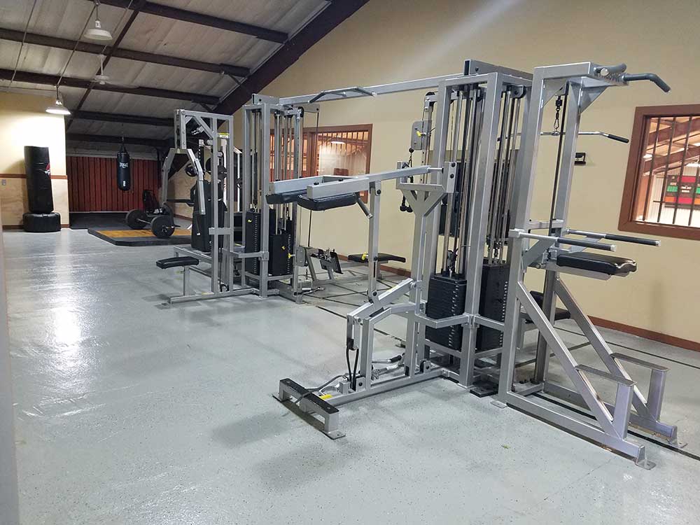 indoor gym with several weight lifting machines