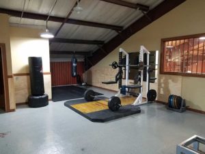 indoor gym with weights and punching bag