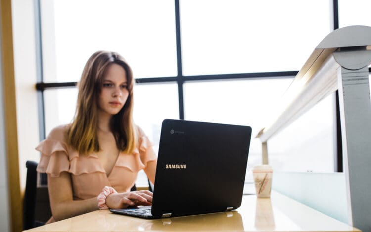 pretty young woman on laptop