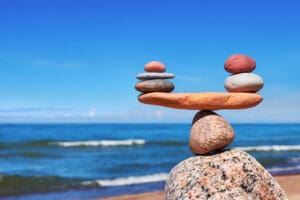 rock sculpture at the beach depicting balance - normal