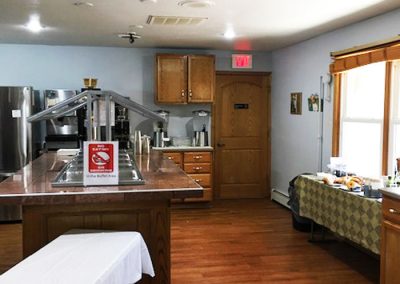 brightly lit kitchen with buffet island - St. Gregory Recovery Center