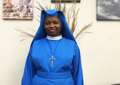 lovely African American nun in bright blue garment - St. Gregory faith based rehab