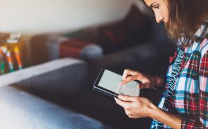 young woman using tablet computer - mindfulness - social distancing