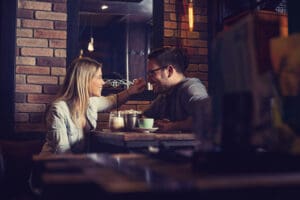 attractive couple on date at cafe - Dating While in Recovery