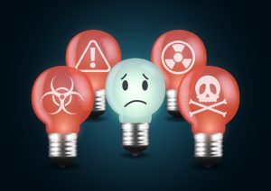Unsupportive Behavior in Recovery, digital illustration of lightbulbs - most are red and have symbols for toxicity and poison while one is blue and has a sad face - unsupportive family and friends